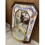 A PAIR OF MIRRORS TO INCLUDE A LARGE WOODEN TILE MIRROR AND A BEVELED GILT OVAL MIRROR