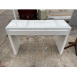 A MODERN WHITE CONSOLE TABLE