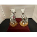 A PAIR OF ORIENTAL (STAMPED) DOG BOOKENDS