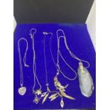 FOUR SILVER NECKLACES MARKED 925 WITH PENDANTS TO INCLUDE A HEART, FLOWER AND BUTTERFLY, INDIAN