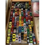 A WOODEN TRAY OF TOY CARS