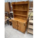 A MODERN PINE DRESSER WITH PLATE RACK, 36" WIDE