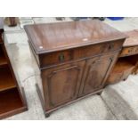 A MODERN MAHOGANY TWO DOOR SIDEBOARD