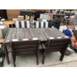 A FOUR SEATER WOODEN GARDEN TABLE WITH FOUR CHAIRS COMPLETE WITH CUSHIONS