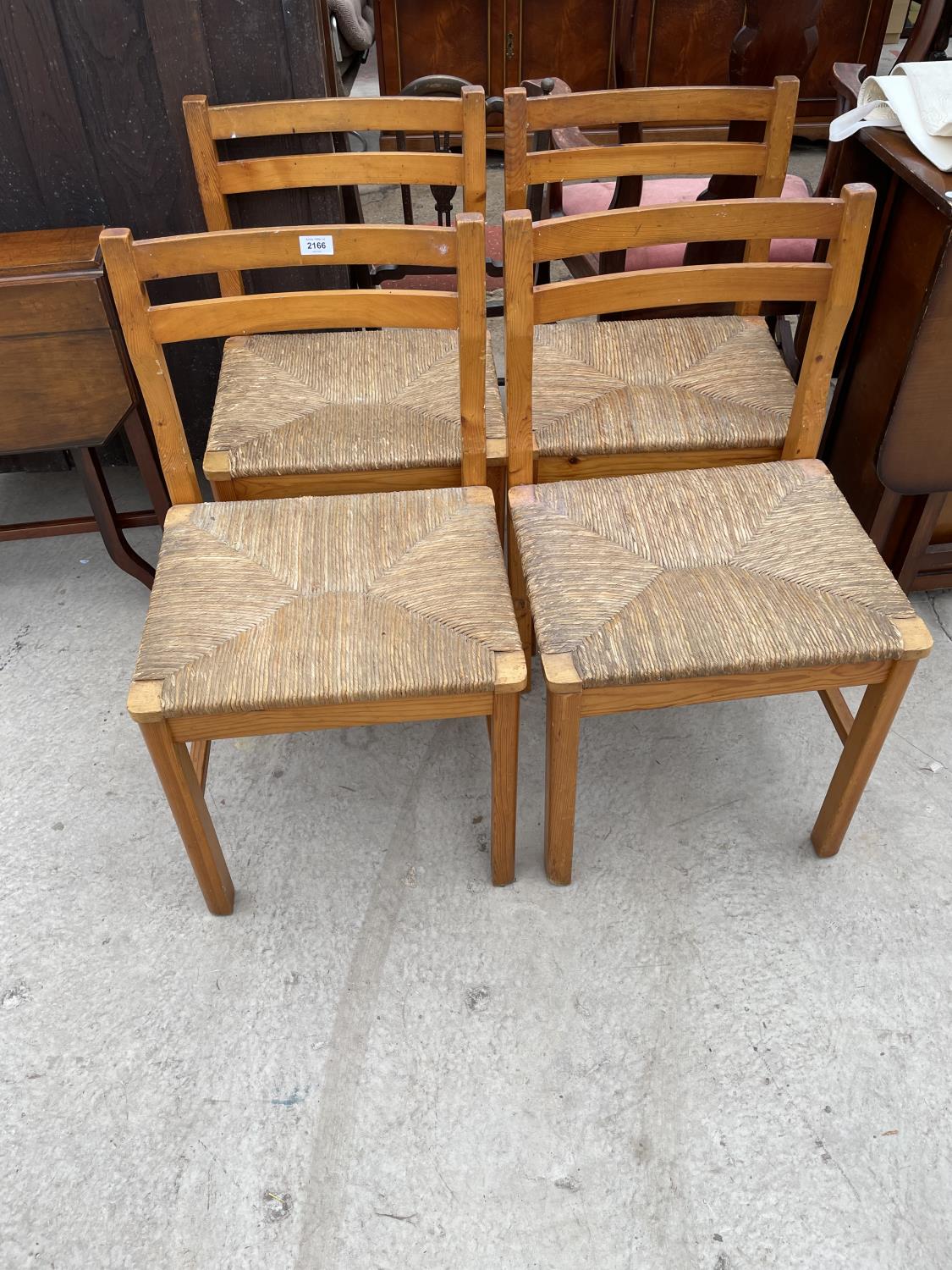 FOUR PINE DINING CHAIRS WITH RUSH SEATS