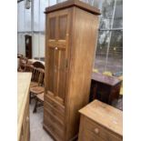 A LATE VICTORIAN NARROW WARDROBE 24" WIDE, ENCLOSING FOUR DRAWERS AND A HANGING SECTION