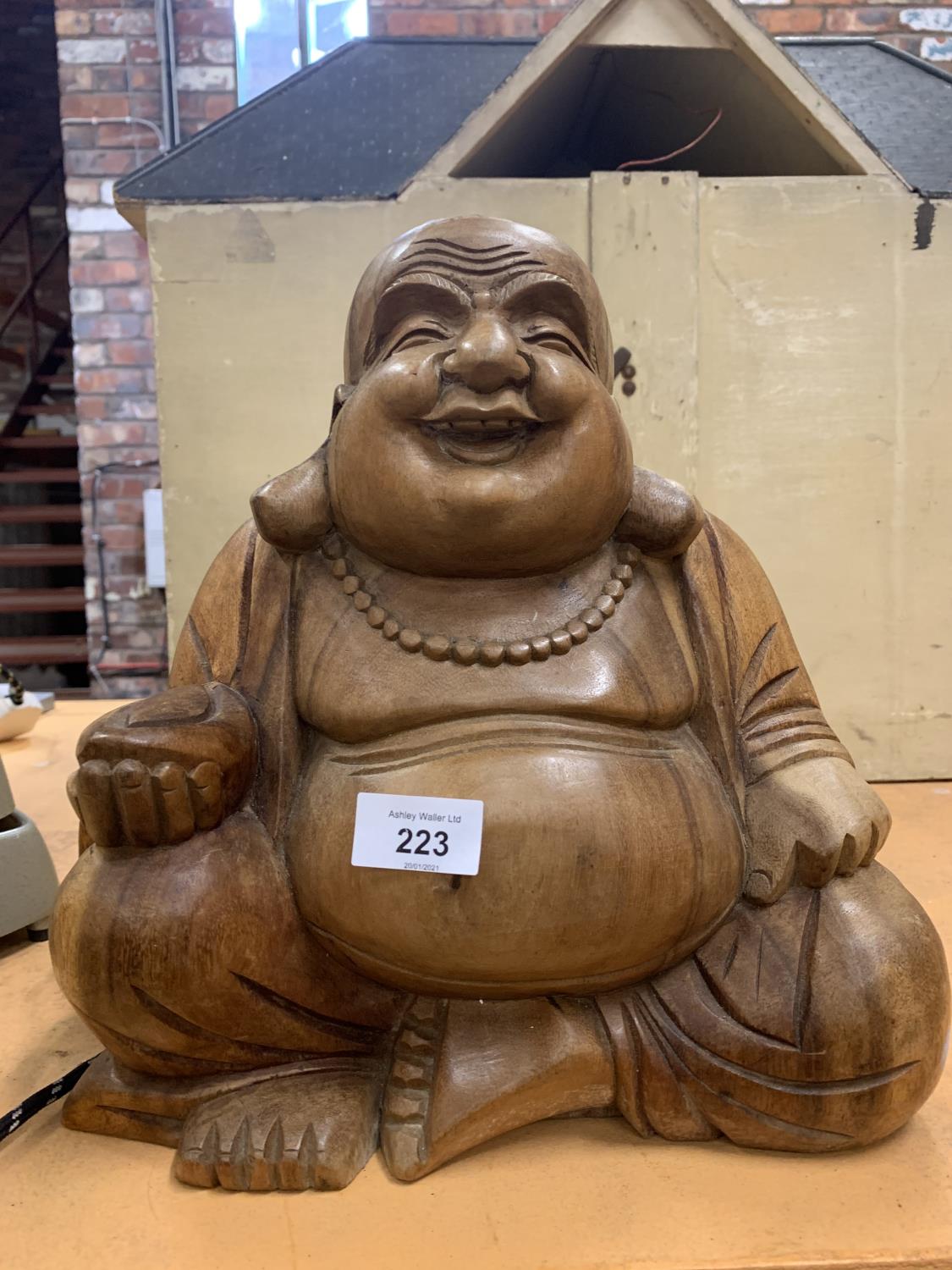 A LARGE CARVED WOODEN BUDDHA