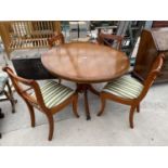 A YEW WOOD CIRCULAR TIP-TOP DINING TABLE AND FOUR CHAIRS