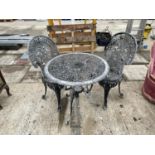 A CAST ALLOY PATIO TABLE AND TWO CHAIRS