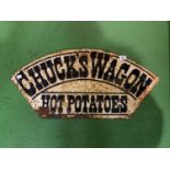 A VINTAGE METAL "CHUCK'S WAGON HOT POTATOES" SIGN