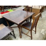 AN OAK DRAW-LEAF TABLE AND TWO CHAIRS