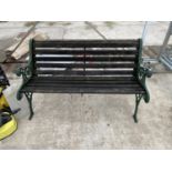 A GARDEN BENCH WITH CAST IRON ENDS