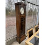 AN EARLY 20TH CENTURY OAK HALL LONGCASE CLOCK WITH GLASS DOOR AND THREE WEIGHTS