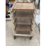 A VINTAGE POTTERS TROLLEY WITH FOUR SHELVES