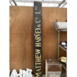 A VINTAGE LARGE WOODEN 'MATTHEW HARVEY AND CO LTD' SIGN (L:210CM W:28CM)