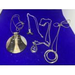 FOUR SILVER NECKLACES MARKED 925 WITH VARIOUS PENDANTS