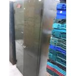 A LARGE METAL TWO DOOR CUPBOARD ENCLOSING FIVE SHELVES