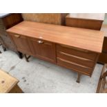 A RETRO TEAK SIDEBOARD ENCLOSING THREE DRAWERS AND TWO CUPBOARDS, 54.5" WIDE