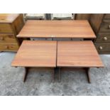 A RETRO G-PLAN STYLE NEST OF THREE TABLES