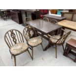AN ERCOL DRAW LEAF ELM DINING TABLE WITH TWO ERCOL CARVERS AND FOUR DINING CHAIRS WITH PRINCE OF