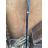 A VINTAGE CASED FISHING ROD AND A LARGE ARMY STYLE SACK