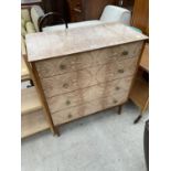 A RETRO CREAMY WALNUT EFFECT CHEST OF FOUR DRAWERS, 32" WIDE