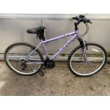 A PURPLE APOLLO LADIES BIKE WITH 18 SPEED SHIMANO GEAR SYSTEM