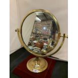 A BRASS 19TH CENTURY STYLE SWING VANITY MIRROR ON A PEDESTAL BASE