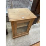 A MODERN PINE CABINET WITH GLAZED DOOR, 22" WIDE