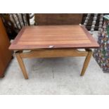 A RETRO G-PLAN STYLE TEAK COFFEE TABLE ON TAPERED LEGS, 29x19"