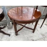 A MODERN CIRCULAR OCCASIONAL TABLE ON REEDED LEGS, 23" DIAMETER