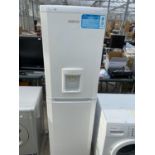 A WHITE BEKO UPRIGHT FRIDGE FREEZER WITH WATER DISPENSER BELIEVED IN WORKING ORDER BUT NO WARRANTY