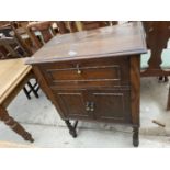 AN EARLY 20TH CENTURY OAK FORMER GRAMOPHONE CABINET ON BARLYTWIST LEGS