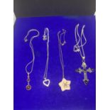FOUR ASSORTED SILVER NECKLACES MARKED 925 AND STERLING WITH CROSS, FLOWER, HEART AND DROP PENDANTS