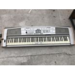 A YAMAHA ELECTRIC KEYBOARD