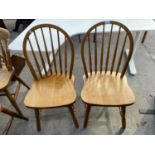 A PAIR OF WINDSOR STYLE KITCHEN CHAIRS