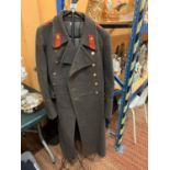 A VINTAGE SOVIET RUSSIAN ARMY GREAT COAT TO INCLUDE A STEEL STAND