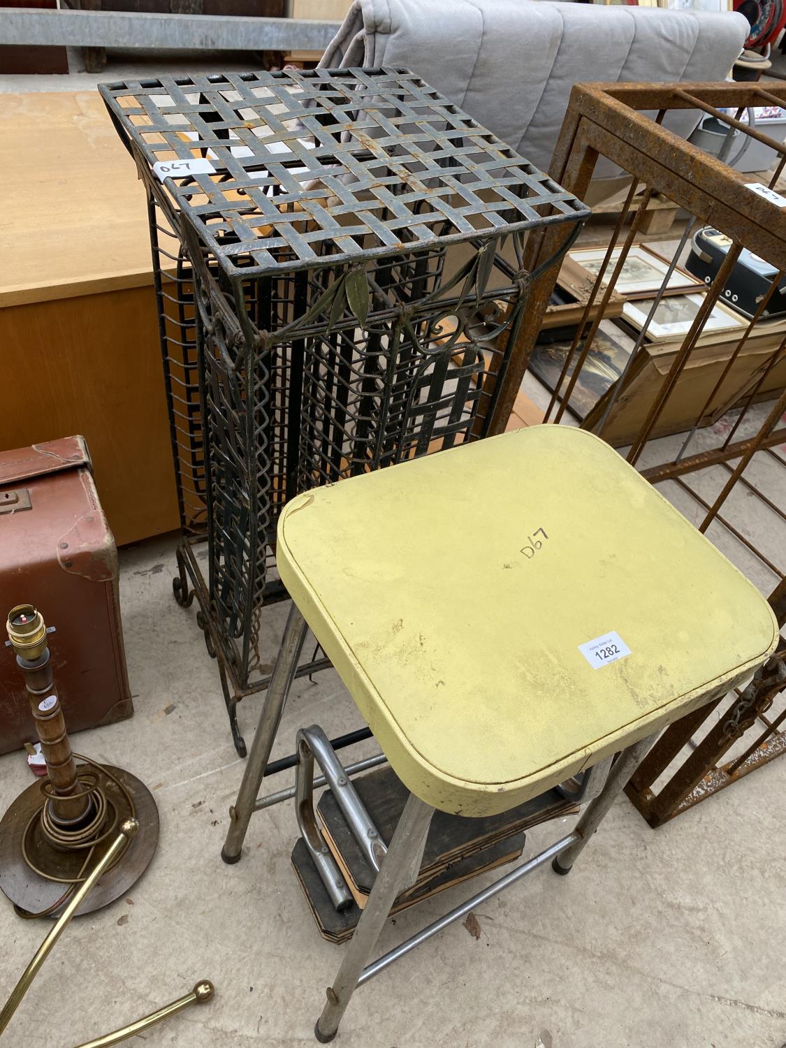 A VINTAGE KITCHEN STOOL WITH STEPS AND A VINTAGE METAL CD RACK