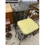 A VINTAGE KITCHEN STOOL WITH STEPS AND A VINTAGE METAL CD RACK