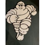 A METAL "MICHELIN MAN" SIGN