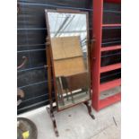 AN MAHOGANY BEVEL EDGE CHEVAL MIRROR