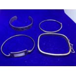FOUR SILVER BANGLES MARKED 925 ONE WITH GRECIAN DESIGN, ONE WITH CLEAR STONES ETC