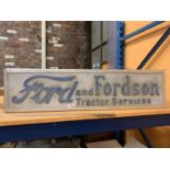 AN ILLUMINATED 'FORD AND FORDSON TRACTOR SERVICES SIGN'