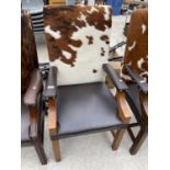 A LEATHER AND COWHIDE ARMCHAIR