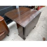 AN OAK DROP-LEAF TABLE