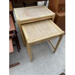A NEST OF TWO BAMBOO TABLES