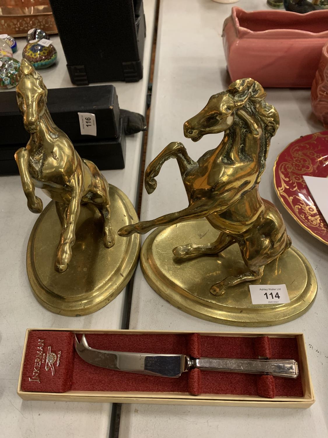 A PAIR OF BRASS REARING HORSES ON PLINTHS AND A INKERMAN SHEFFIELD CHEESE KNIFE