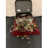 A SMALL VANITY CASE CONTAINING VARIOUS COSTUME JEWELLERY