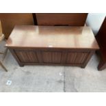 A REPRODUCTION OAK BLANKET CHEST WITH THREE LINEN FOLD FRONT PANELS, 45" WIDE