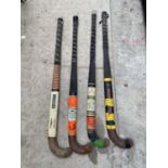 FOUR VINTAGE HOCKEY STICKS